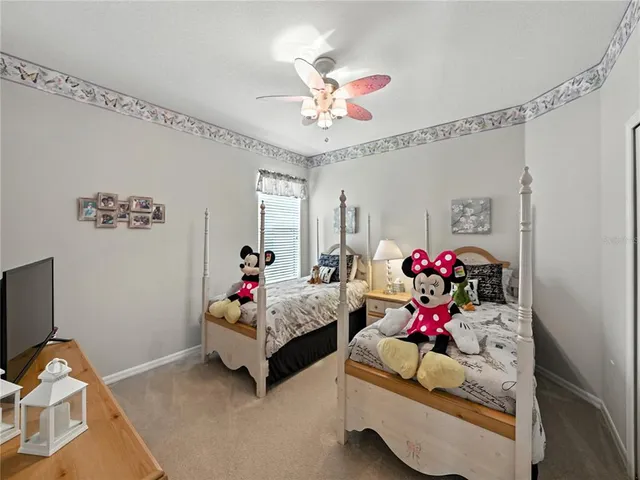 a bed room with furniture and a chandelier