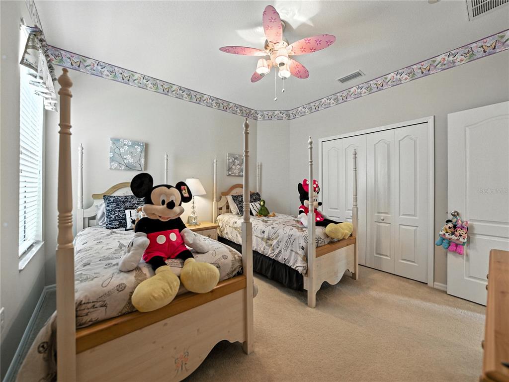 2530 Cross More Street Valrico, FL 33594 - Photo 18 of 61 a bed room with furniture and a chandelier