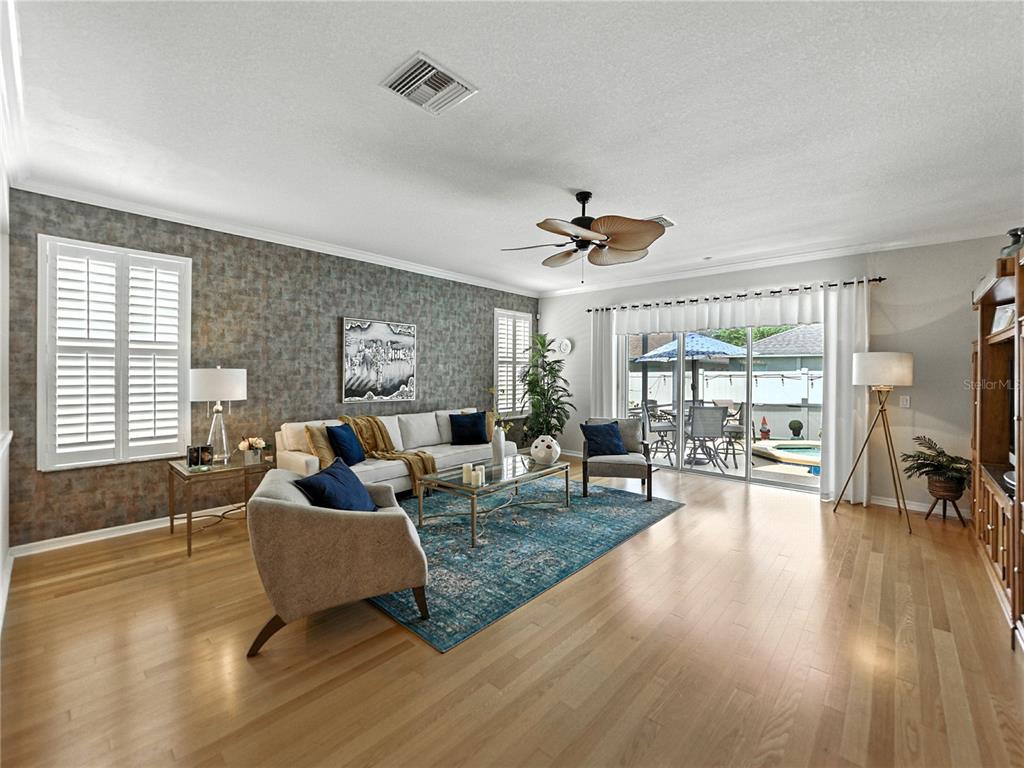 2530 Cross More Street Valrico, FL 33594 - Photo 22 of 61 a living room with furniture and a wooden floor