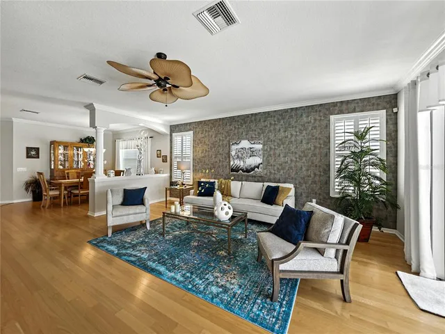 a view of living room kitchen and dining room