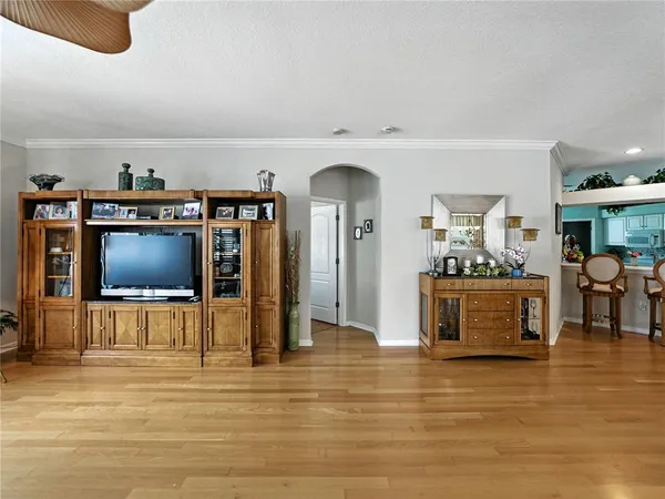 a large kitchen with kitchen island a sink stainless steel appliances and cabinets