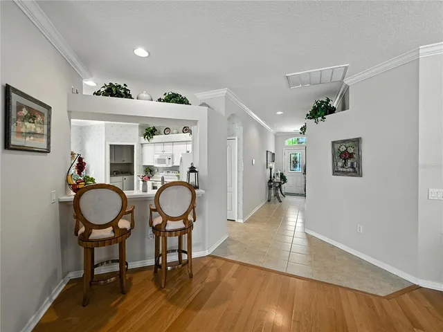 a kitchen with white cabinets and center island