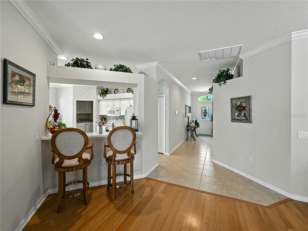 2530 Cross More Street Valrico, FL 33594 - Photo 28 of 61 a view of a dining room with furniture wooden floor and chandelier