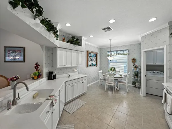 a view of a dining room that has a table and chairs