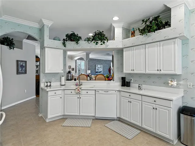 a view of a dining room with a table and chairs