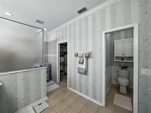 an outdoor space with patio and white umbrellas