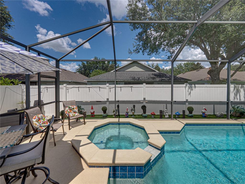 2530 Cross More Street Valrico, FL 33594 - Photo 51 of 61 an outdoor space with patio and white umbrellas