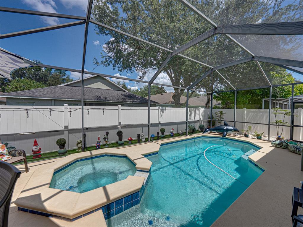 2530 Cross More Street Valrico, FL 33594 - Photo 52 of 61 a swimming pool with outdoor seating and yard