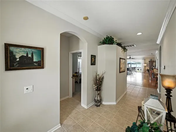 a large bedroom with a bed and a flat screen tv