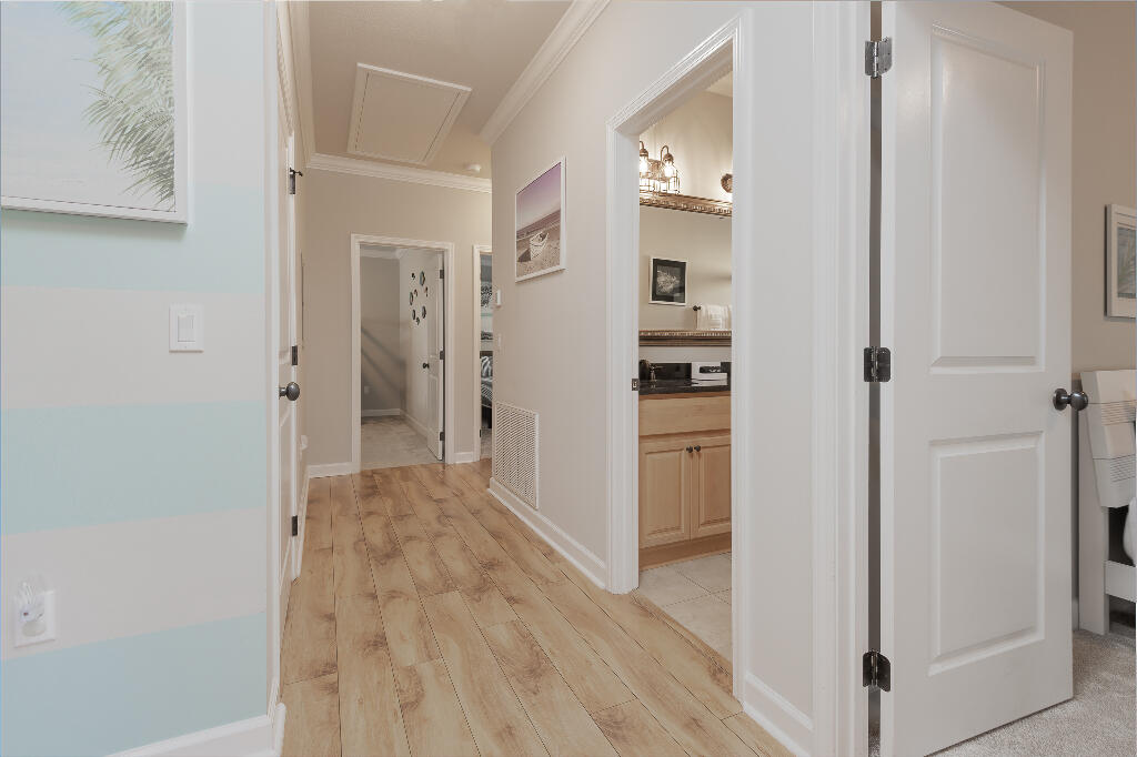 202 Kono Way Destin, FL 32541 - Photo 24 of 29 a view of a hallway with wooden floor and closet