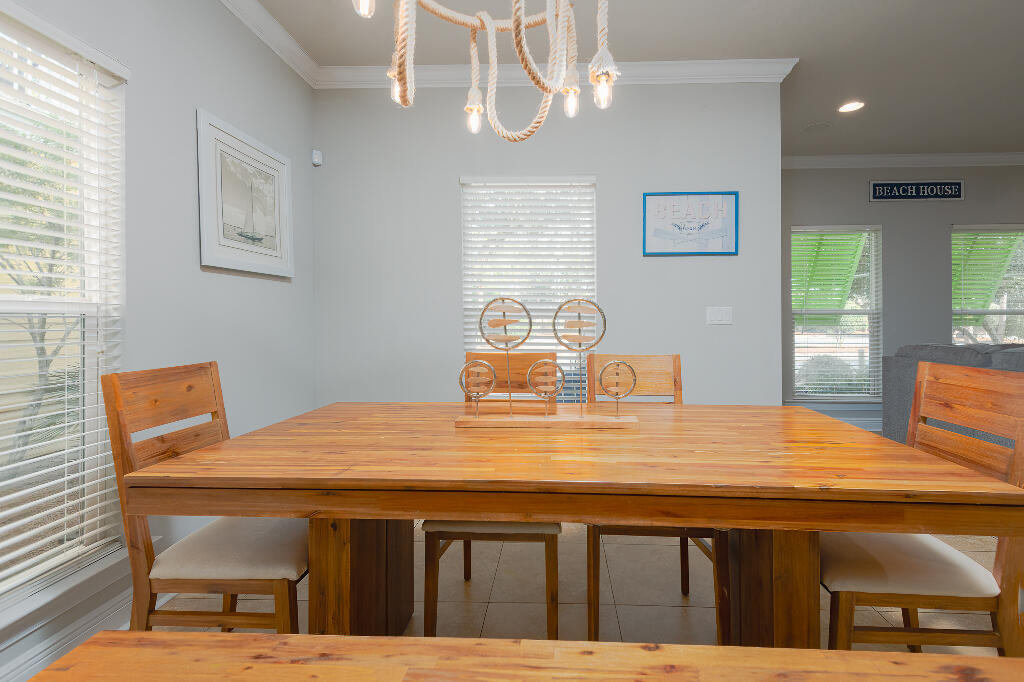 202 Kono Way Destin, FL 32541 - Photo 27 of 29 a kitchen with a table chairs and wooden floor