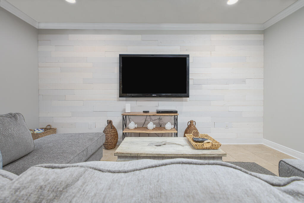 202 Kono Way Destin, FL 32541 - Photo 8 of 29 a living room with furniture and a flat screen tv