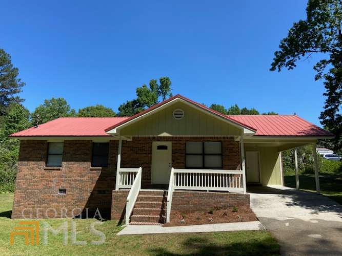 a front view of a house with a porch