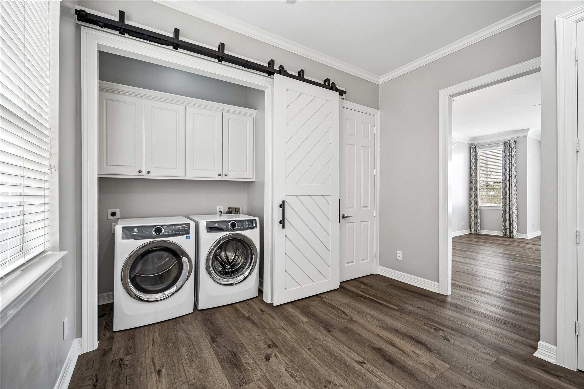 2423 Ralph Street Houston, TX 77006 - Photo 11 of 24 a view of a storage and utility room with wooden floor