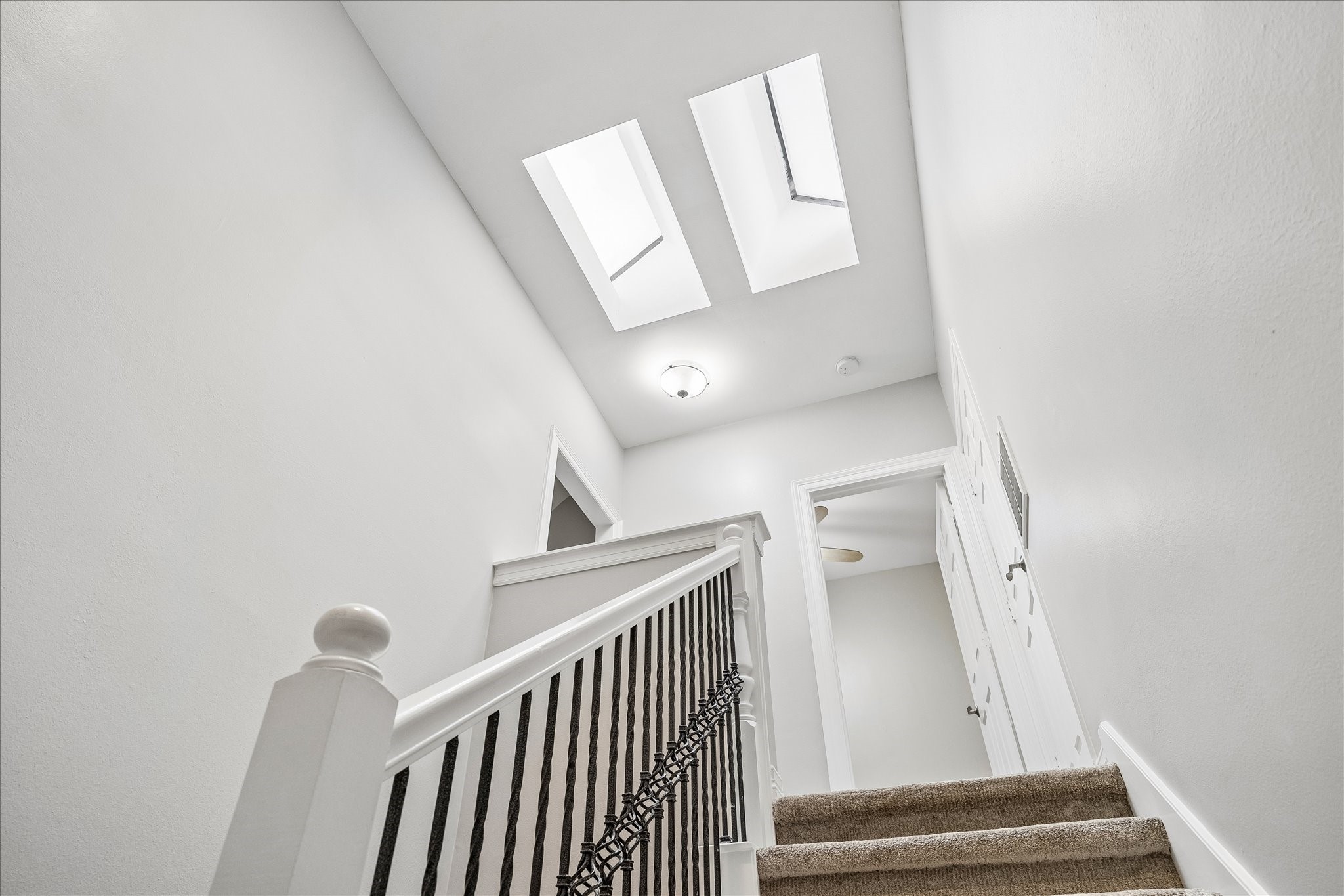 2423 Ralph Street Houston, TX 77006 - Photo 13 of 24 a view of a hallway with staircase