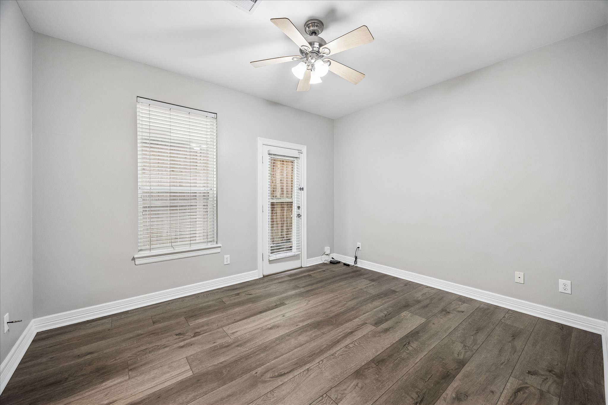2423 Ralph Street Houston, TX 77006 - Photo 3 of 24 wooden floor in an empty room with a window