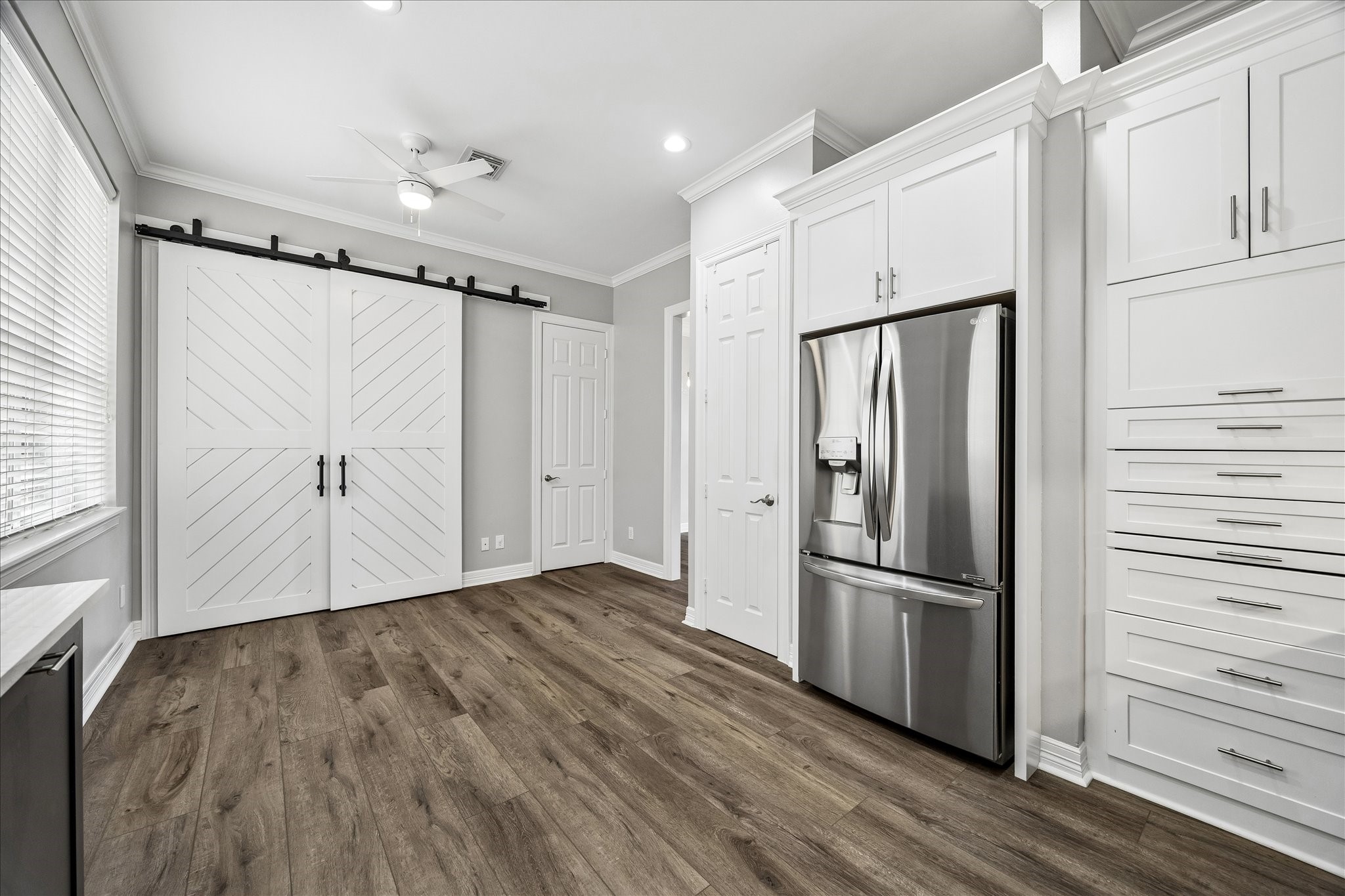 2423 Ralph Street Houston, TX 77006 - Photo 5 of 24 a view of a refrigerator in kitchen and wooden floor