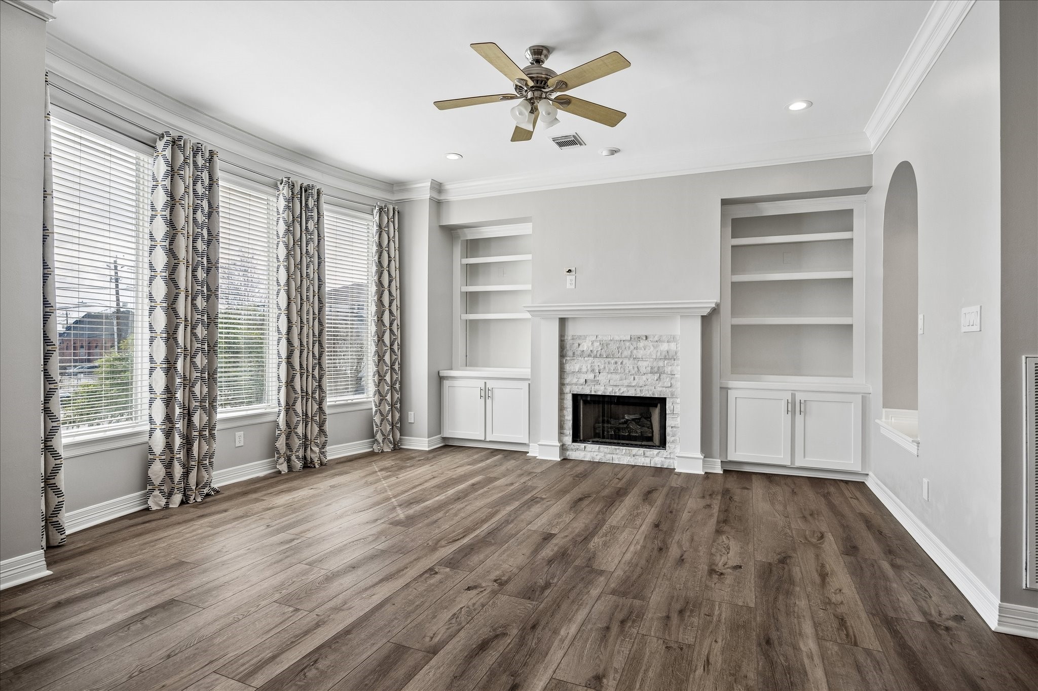 2423 Ralph Street Houston, TX 77006 - Photo 7 of 24 wooden floor fireplace and windows in an empty room