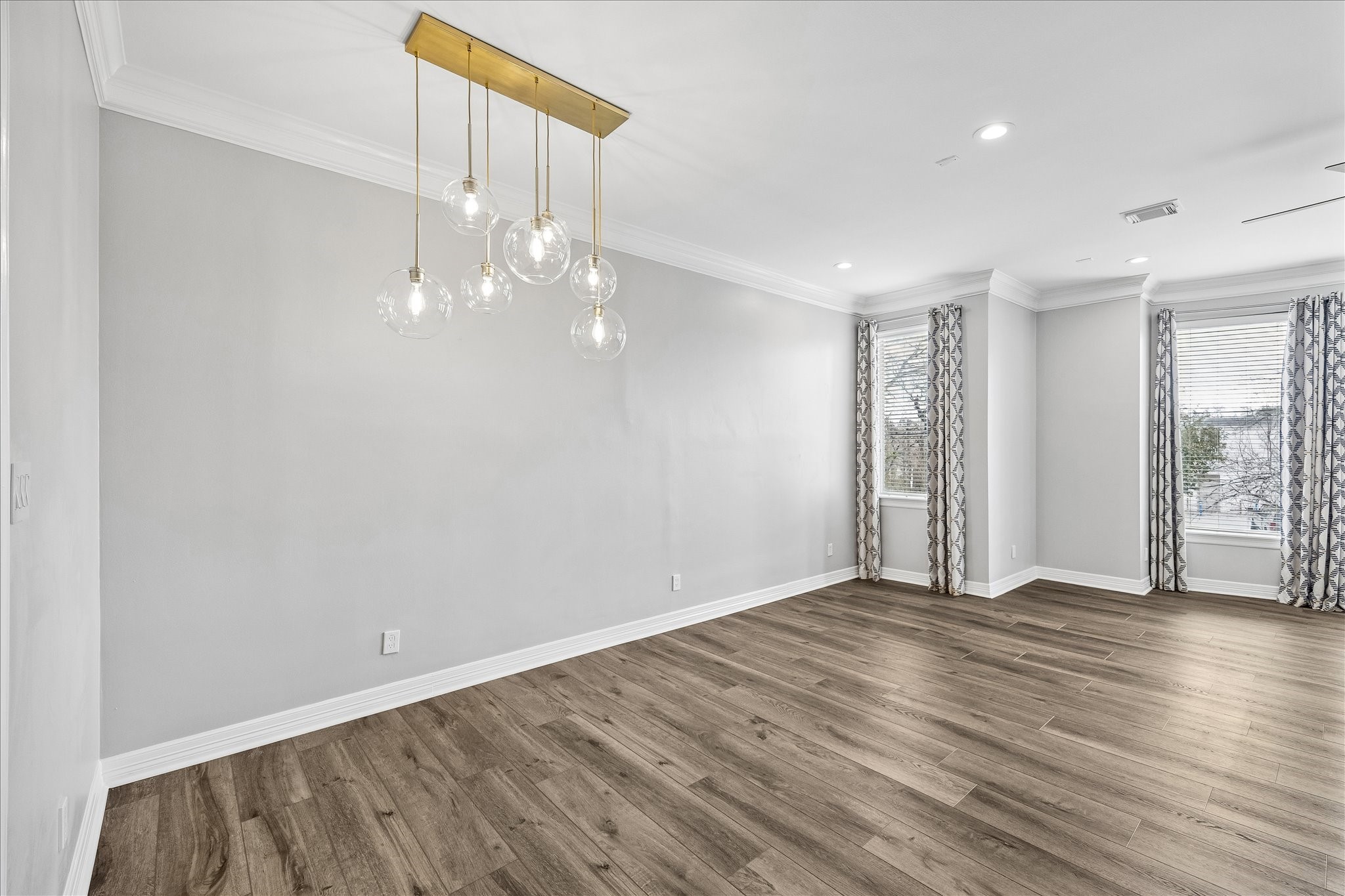 2423 Ralph Street Houston, TX 77006 - Photo 9 of 24 wooden floor in an empty room with a window