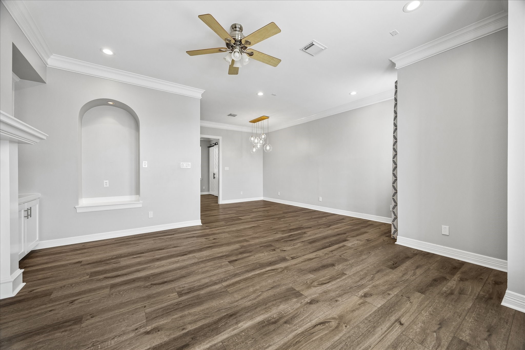 2423 Ralph Street Houston, TX 77006 - Photo 10 of 24 wooden floor in an empty room with a window