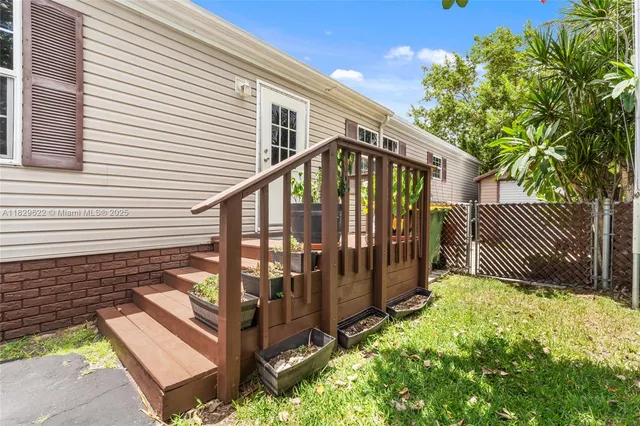 a view of a house with wooden fence