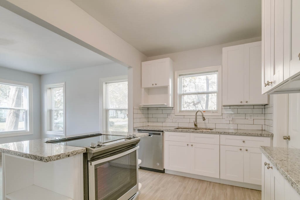 3321 Charleston Street Houston, TX 77021 - Photo 2 of 32 a view of a kitchen with a sink a window and appliances