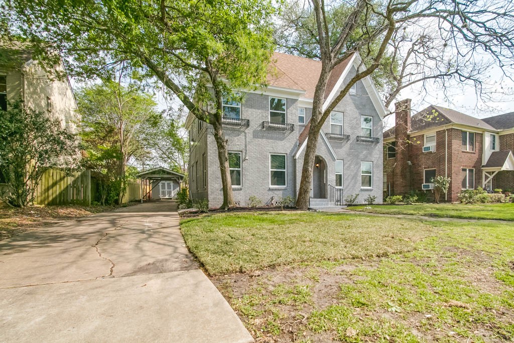 3321 Charleston Street Houston, TX 77021 - Photo 26 of 32 a view of a white house next to a yard with big trees