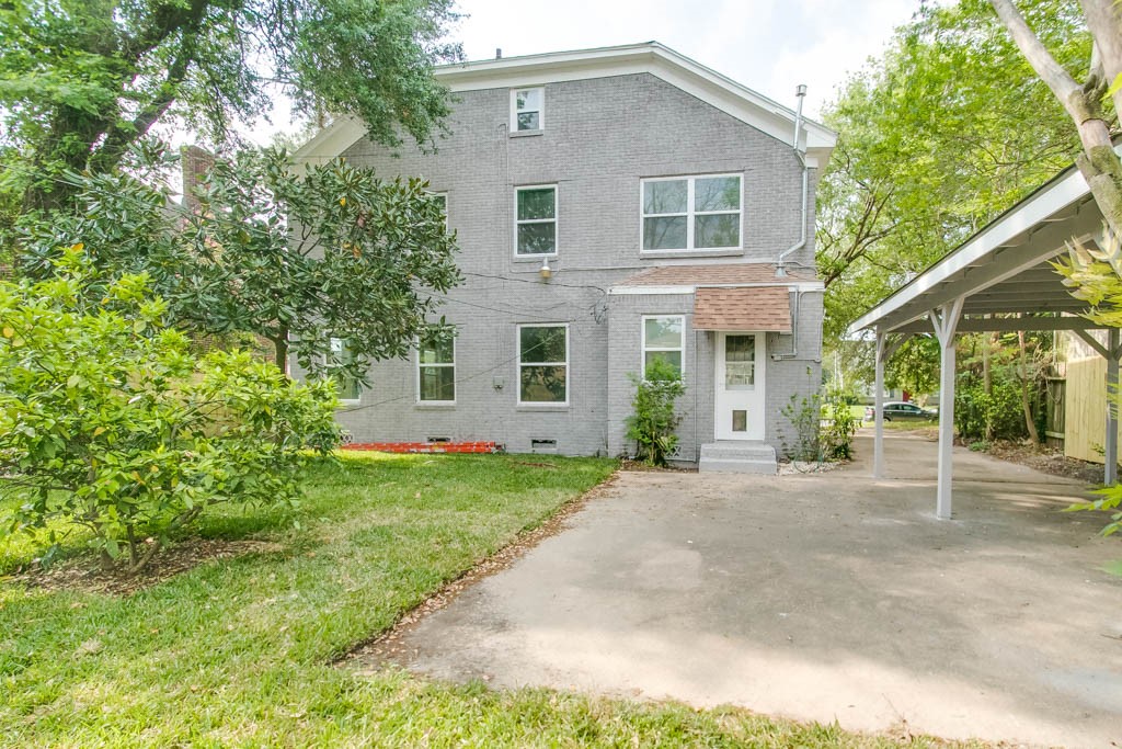 3321 Charleston Street Houston, TX 77021 - Photo 27 of 32 a front view of a house with a yard and potted plants