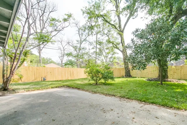 a view of backyard with green space