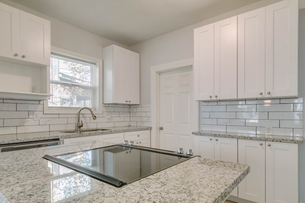 3321 Charleston Street Houston, TX 77021 - Photo 3 of 32 a kitchen that has a sink and a stove in it