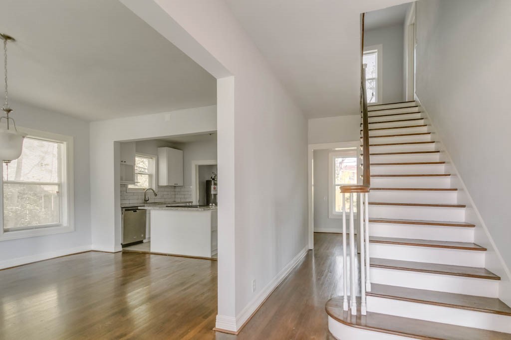 3321 Charleston Street Houston, TX 77021 - Photo 10 of 32 a view of a kitchen with wooden floor and stairs
