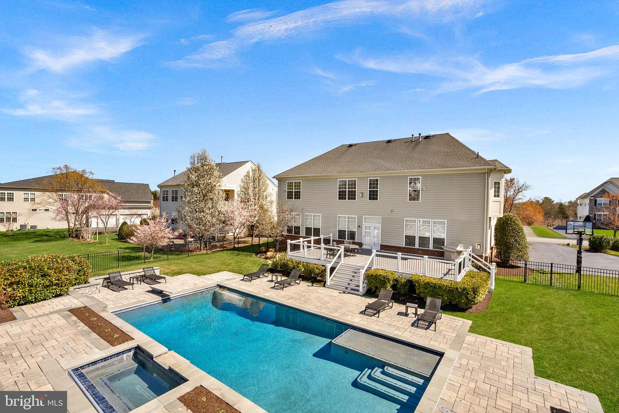 22461 Terra Rosa Place Ashburn, VA 20148 - Photo 2 of 67 a view of a house with couches chairs and a big yard