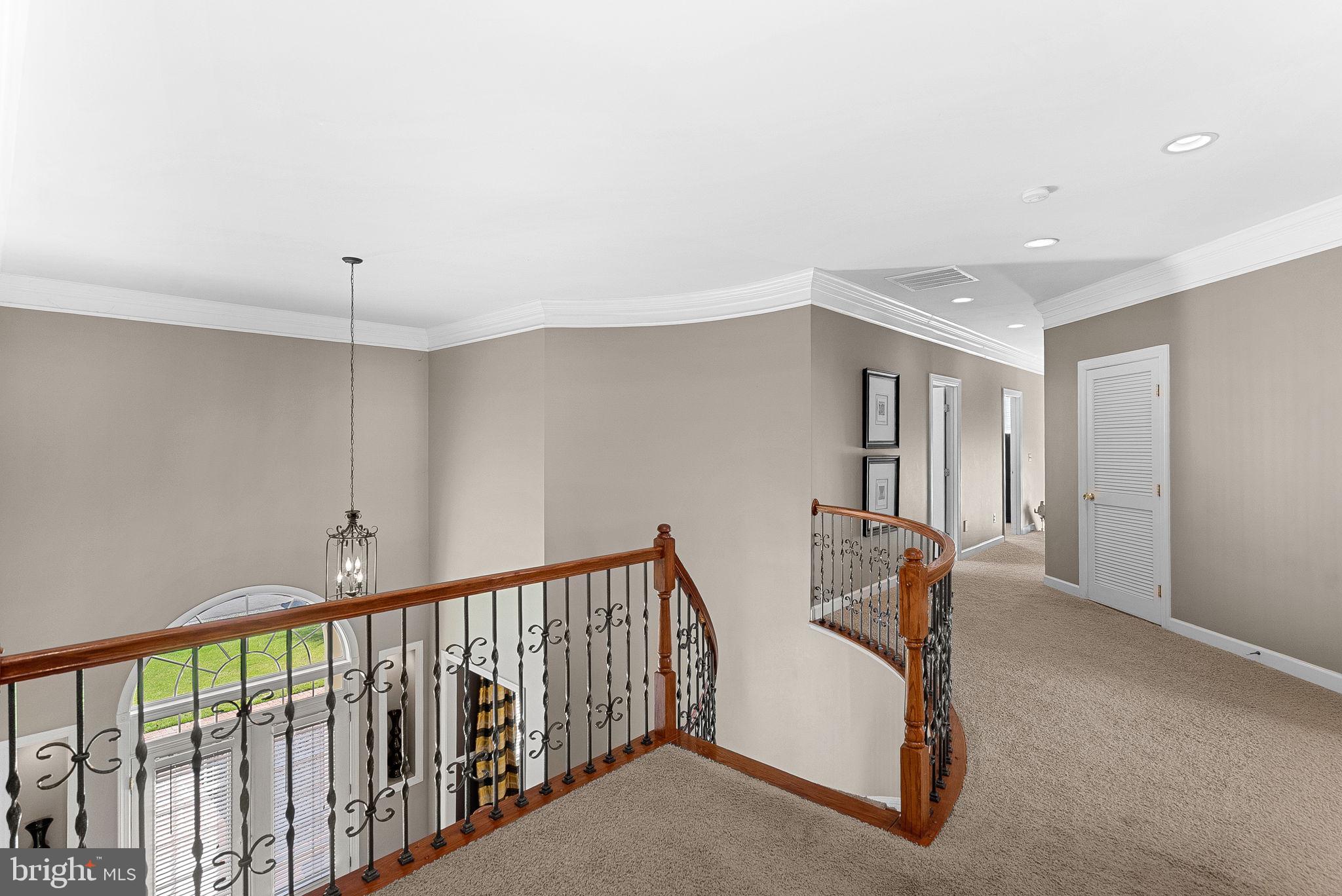 22461 Terra Rosa Place Ashburn, VA 20148 - Photo 21 of 67 a view of a hallway with workspace and window