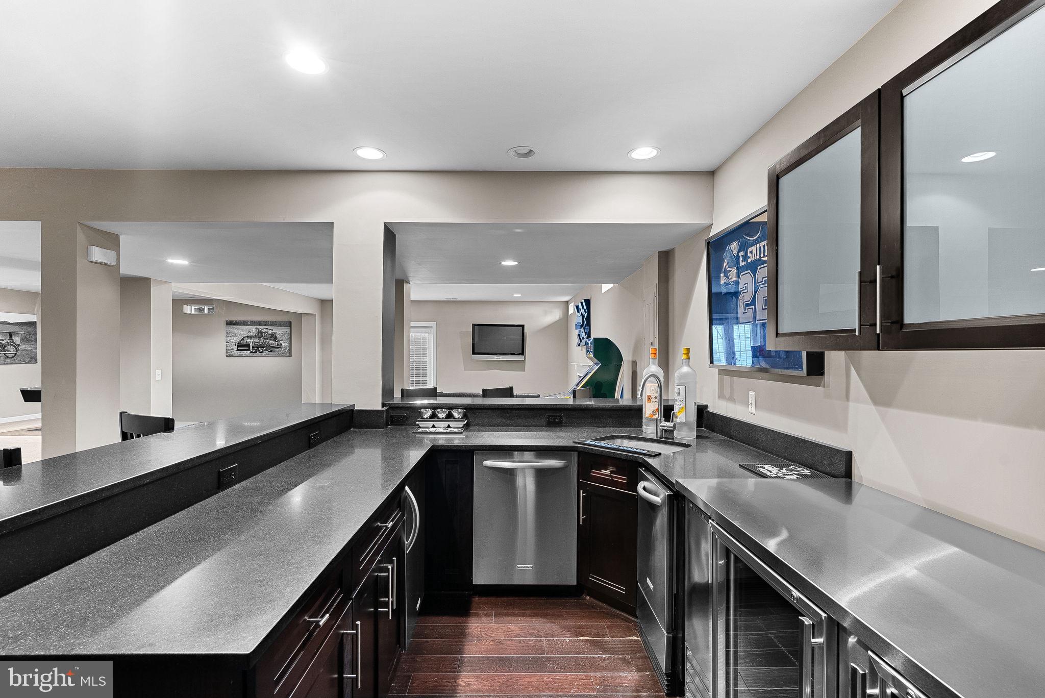 22461 Terra Rosa Place Ashburn, VA 20148 - Photo 38 of 67 a kitchen with a sink stove and cabinets