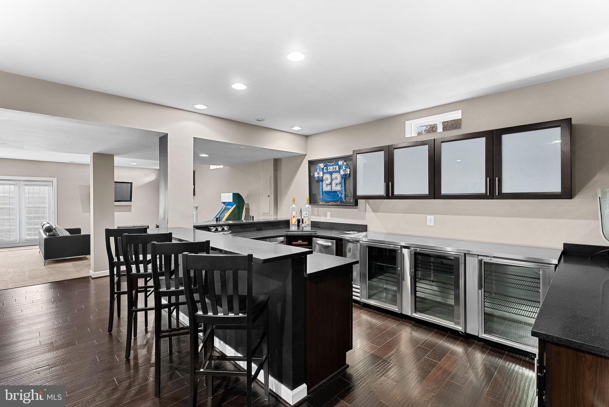 22461 Terra Rosa Place Ashburn, VA 20148 - Photo 40 of 67 a view of a dining room with furniture and wooden floor