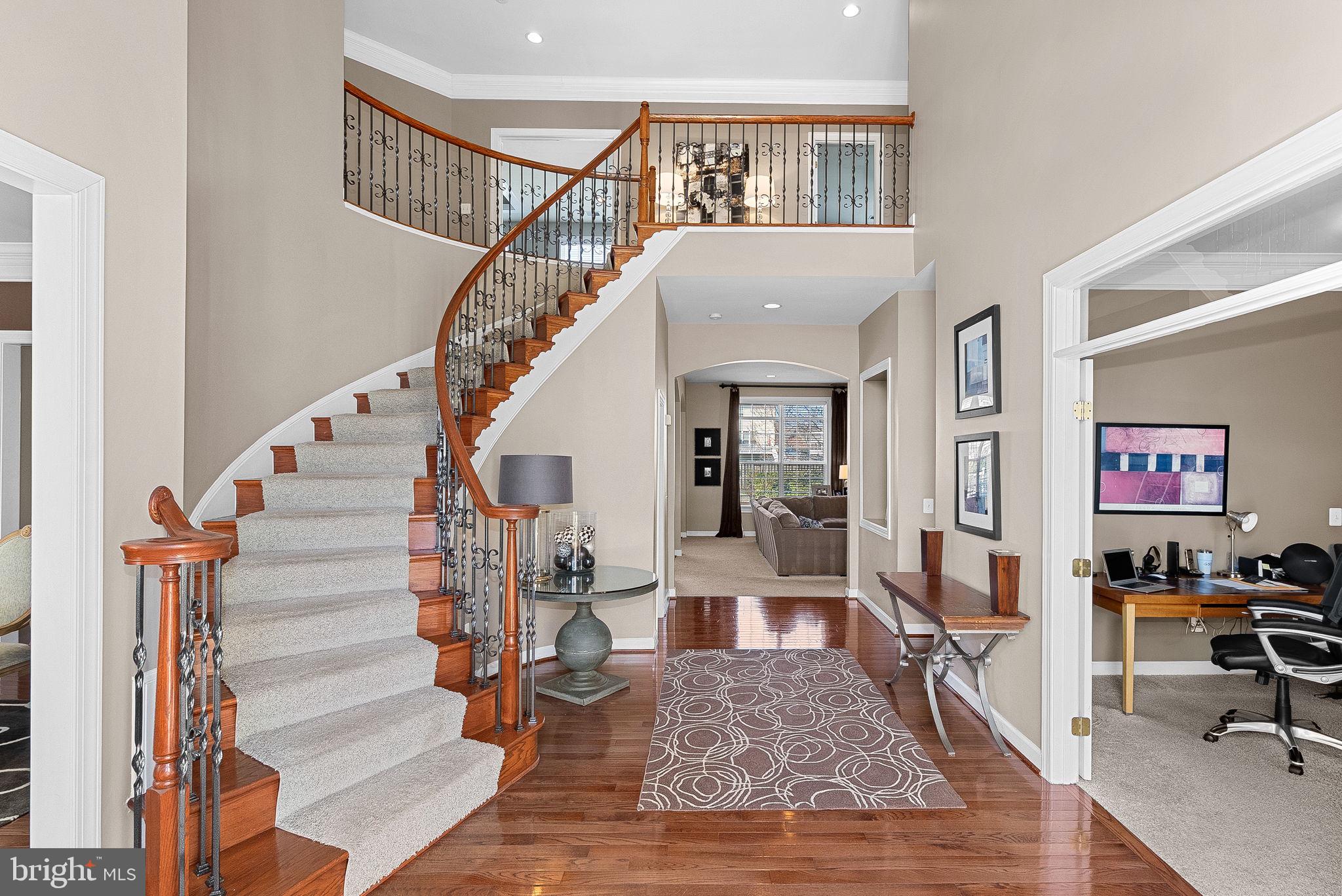 22461 Terra Rosa Place Ashburn, VA 20148 - Photo 4 of 67 a view of entryway livingroom and hall with wooden floor