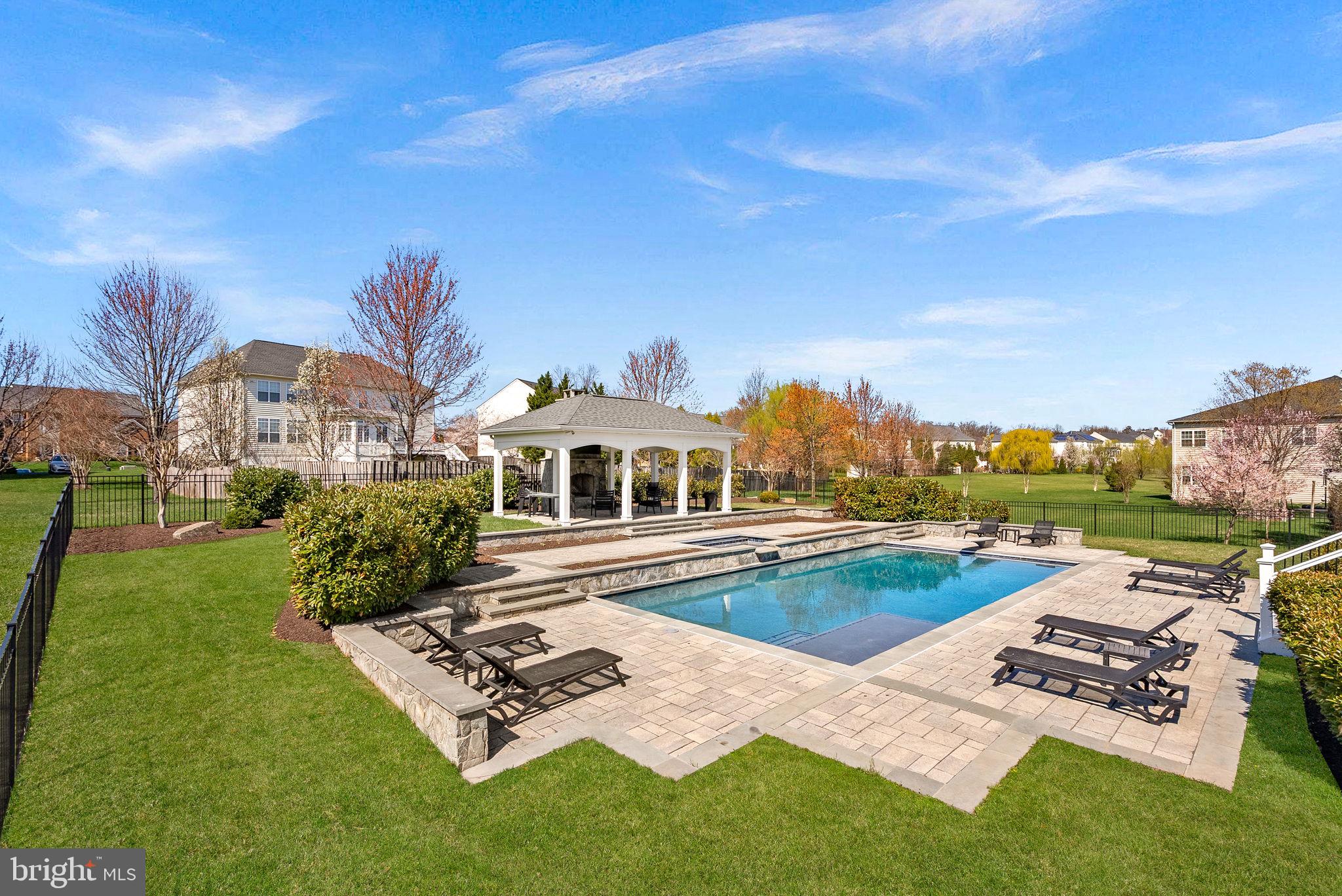 22461 Terra Rosa Place Ashburn, VA 20148 - Photo 50 of 67 a front view of a house with garden