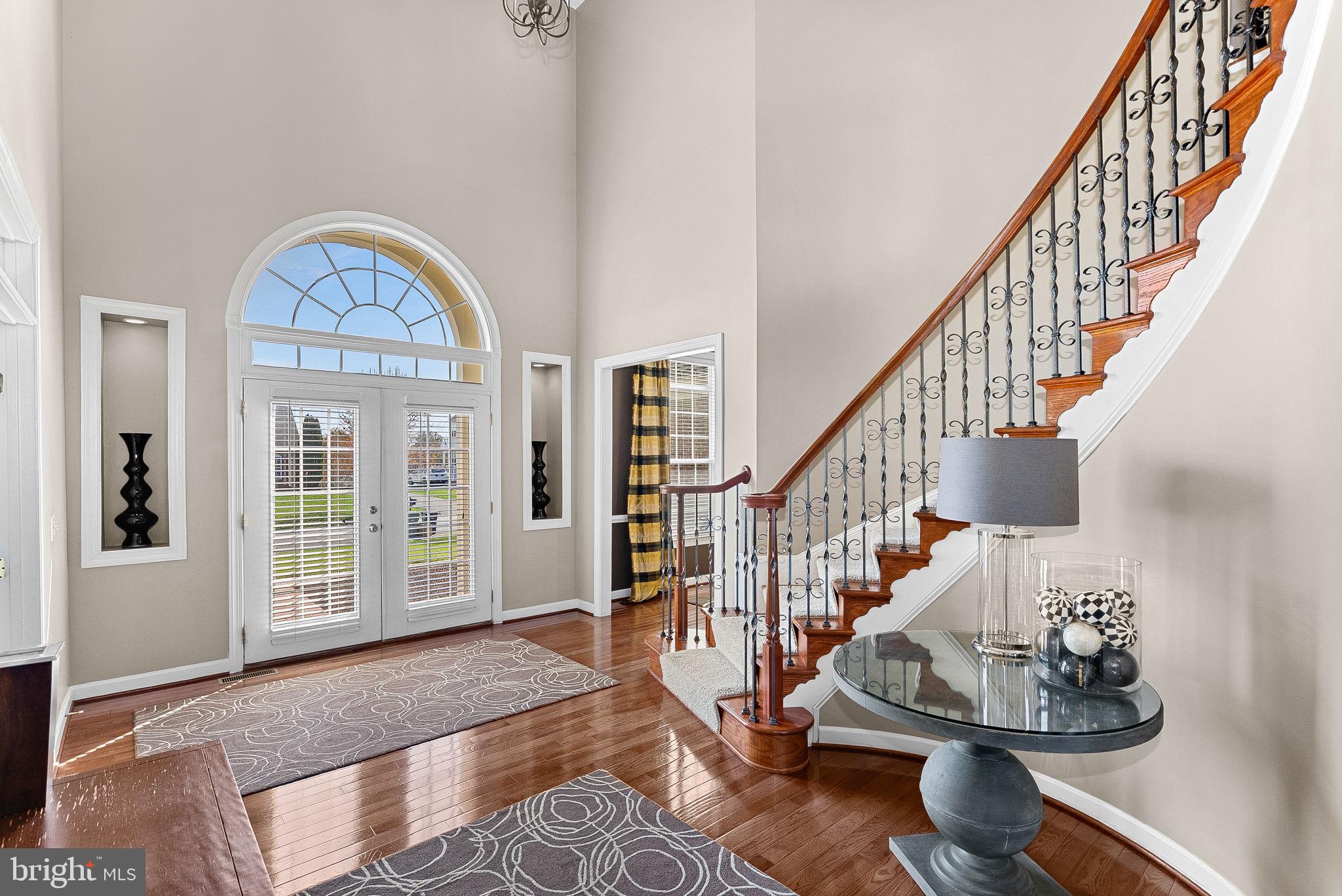 22461 Terra Rosa Place Ashburn, VA 20148 - Photo 5 of 67 a view of entryway and hall with wooden floor