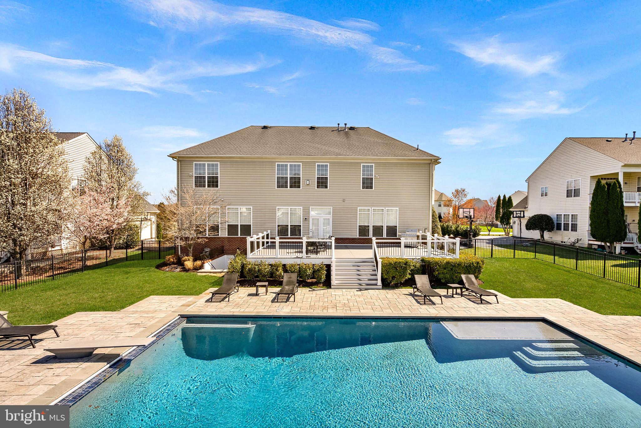22461 Terra Rosa Place Ashburn, VA 20148 - Photo 51 of 67 a view of a house with pool porch and chairs