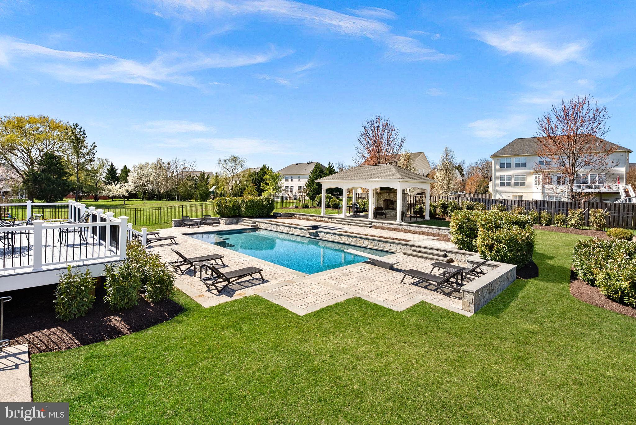 22461 Terra Rosa Place Ashburn, VA 20148 - Photo 52 of 67 a front view of a house with garden