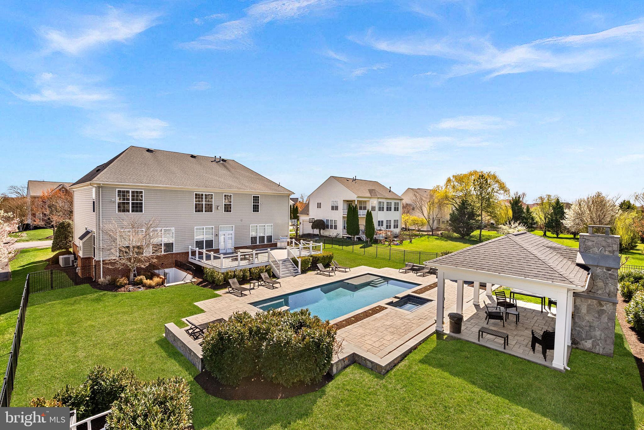 22461 Terra Rosa Place Ashburn, VA 20148 - Photo 53 of 67 a aerial view of a house with swimming pool and yard