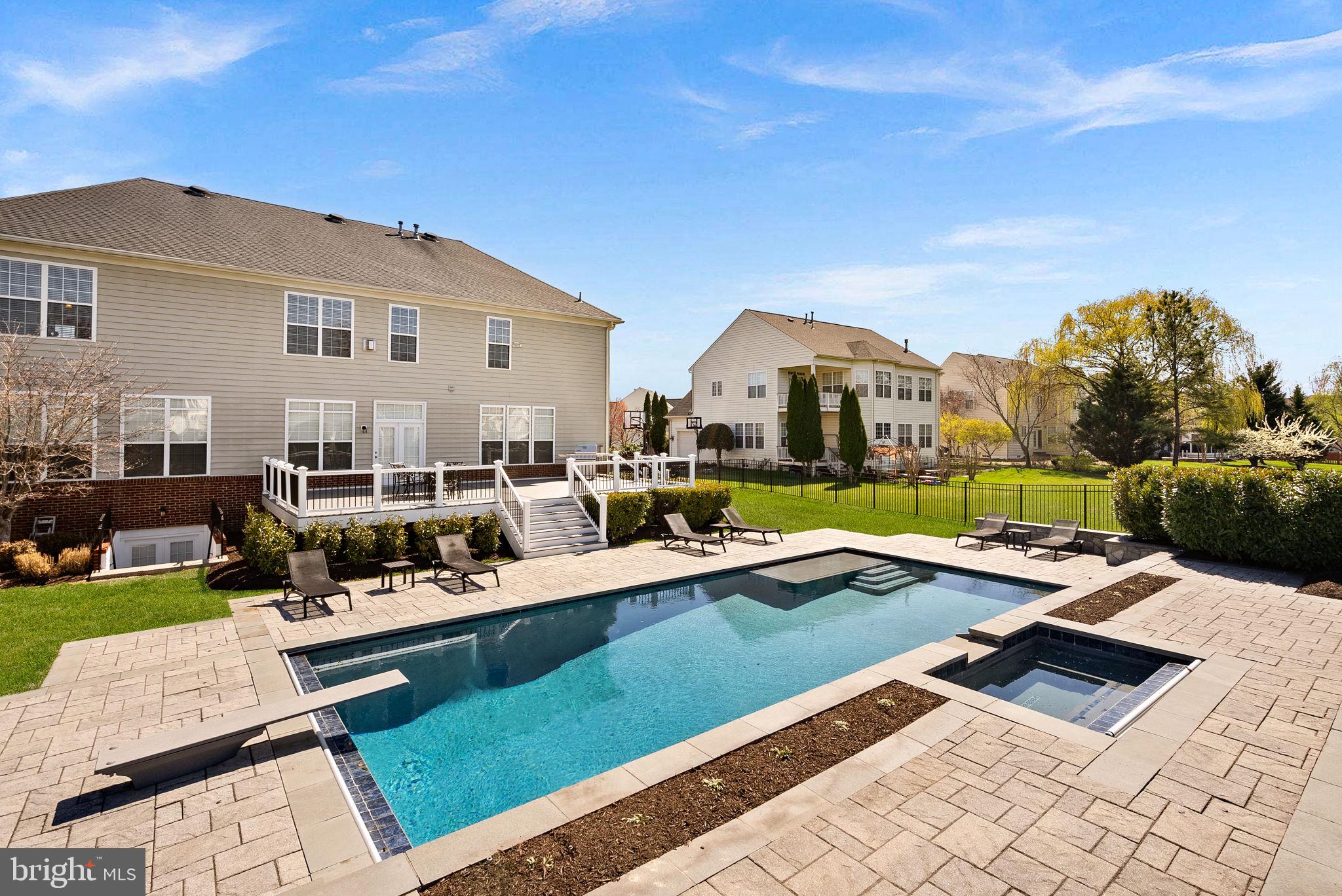 22461 Terra Rosa Place Ashburn, VA 20148 - Photo 54 of 67 a view of a house with swimming pool and sitting area