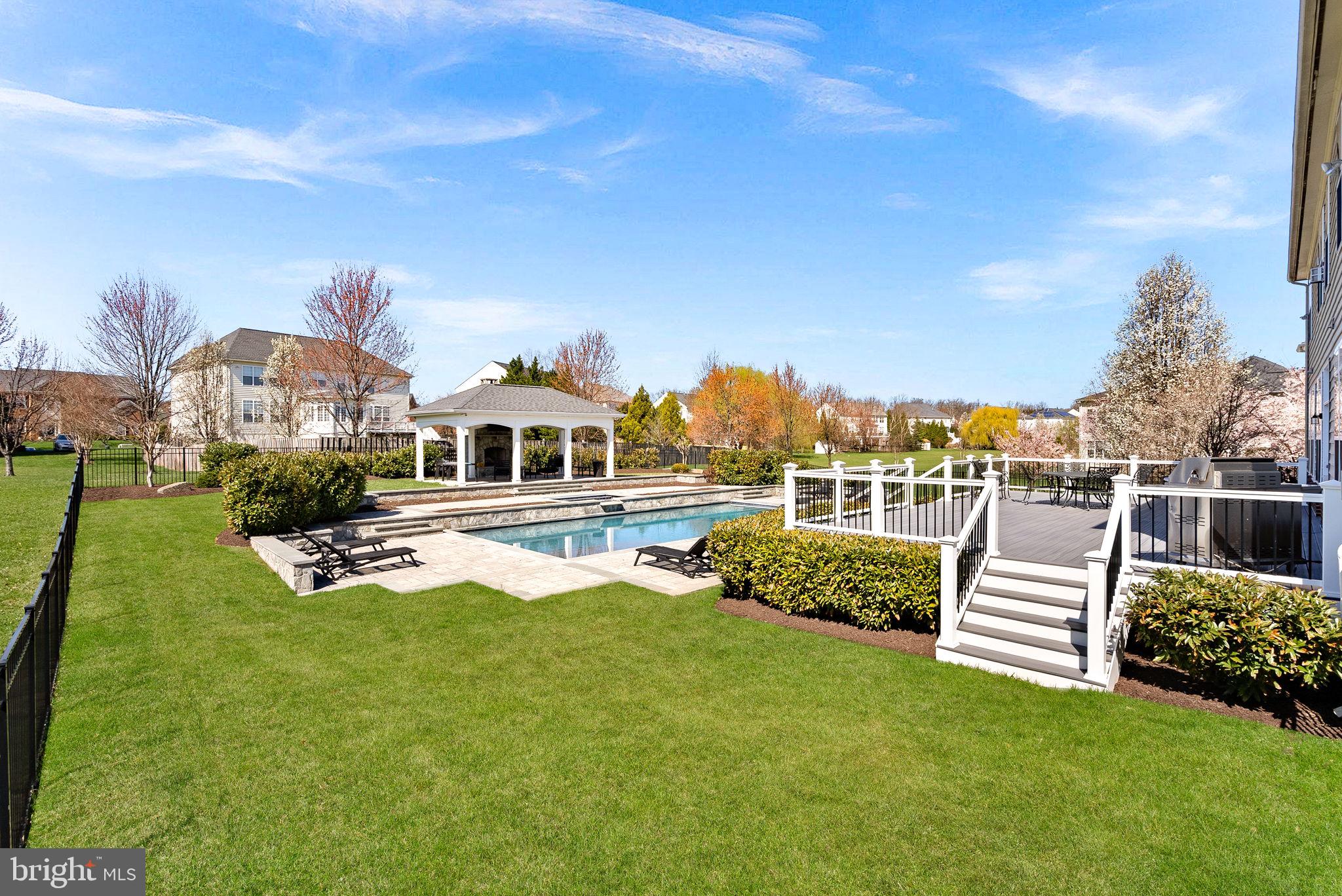 22461 Terra Rosa Place Ashburn, VA 20148 - Photo 55 of 67 a front view of a house with garden