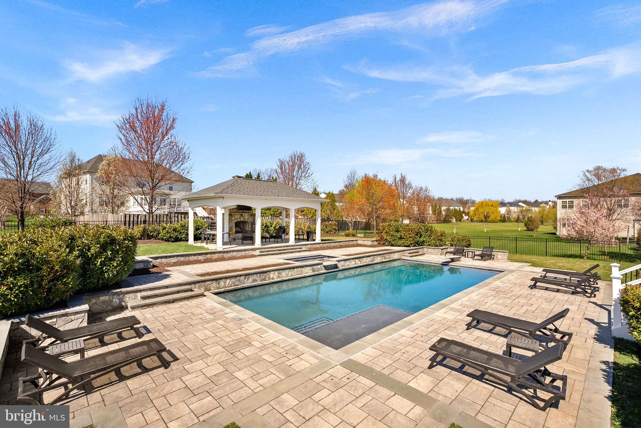 22461 Terra Rosa Place Ashburn, VA 20148 - Photo 56 of 67 a view of a patio with swimming pool and furniture
