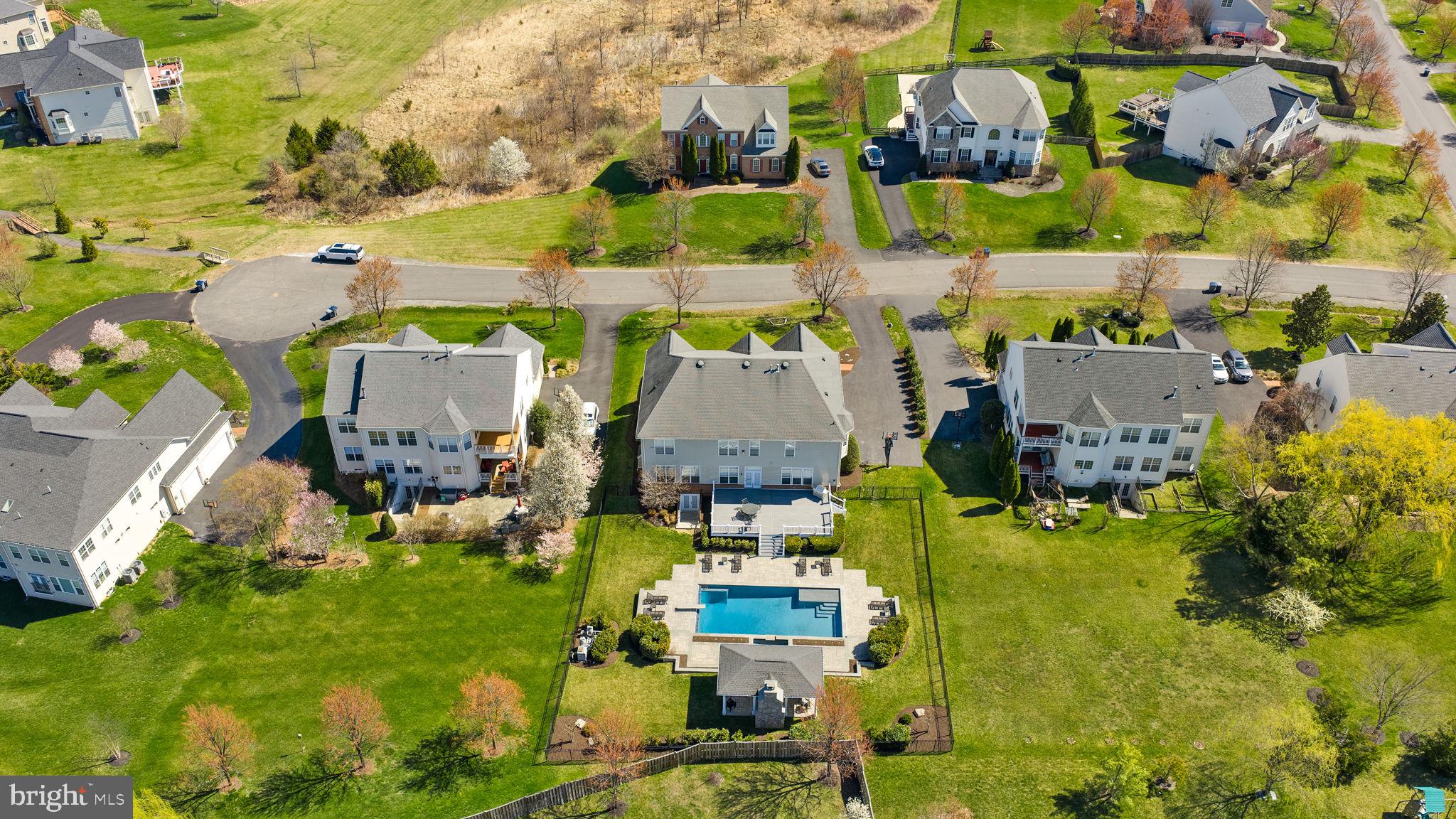 22461 Terra Rosa Place Ashburn, VA 20148 - Photo 61 of 67 an aerial view of residential houses with outdoor space and parking