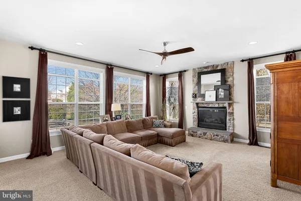 a view of a house with swimming pool and sitting area