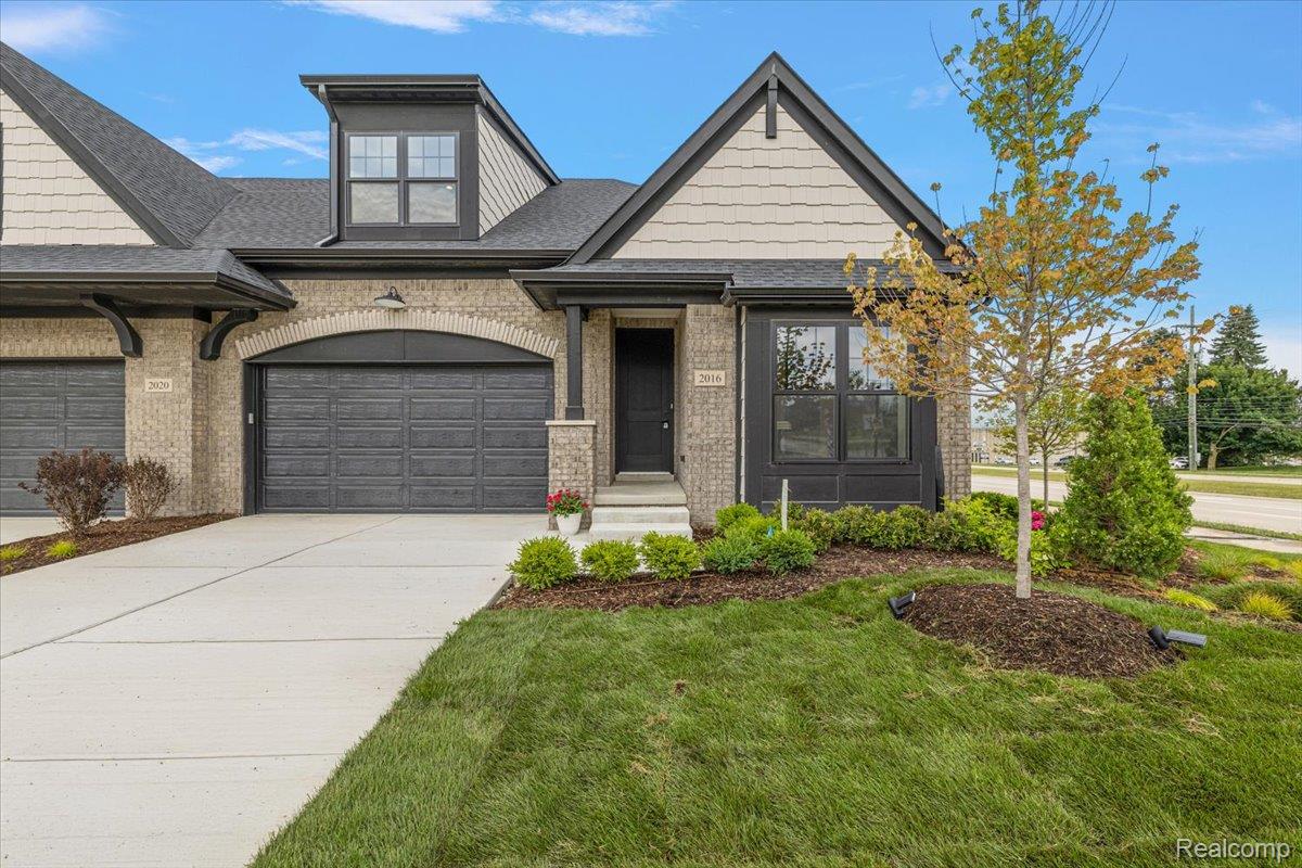 2027 Breckenridge Court, Unit 3 Rochester, MI 48309 - Photo 3 of 42 Brick and siding exterior with dark trim accents