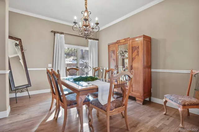 a living room with furniture a fireplace and windows