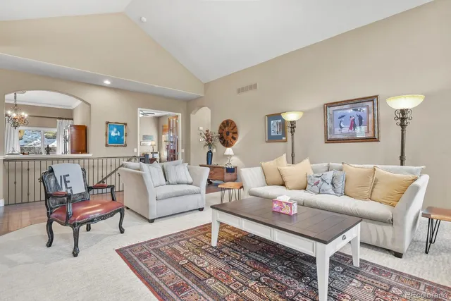 a living room with furniture fireplace and window