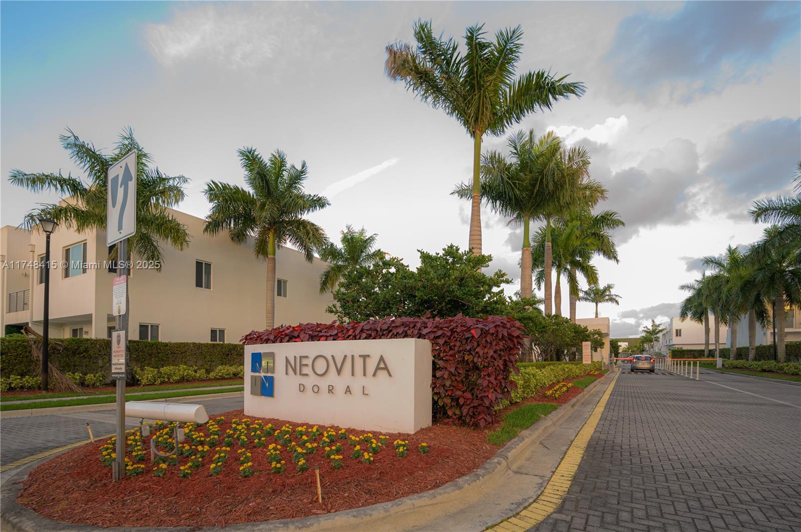 a sign board with palm trees